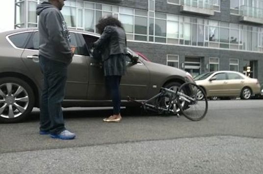 John Roemer's bicycle wedged up under the driver's wheel, supposedly causing $2,000 in damages